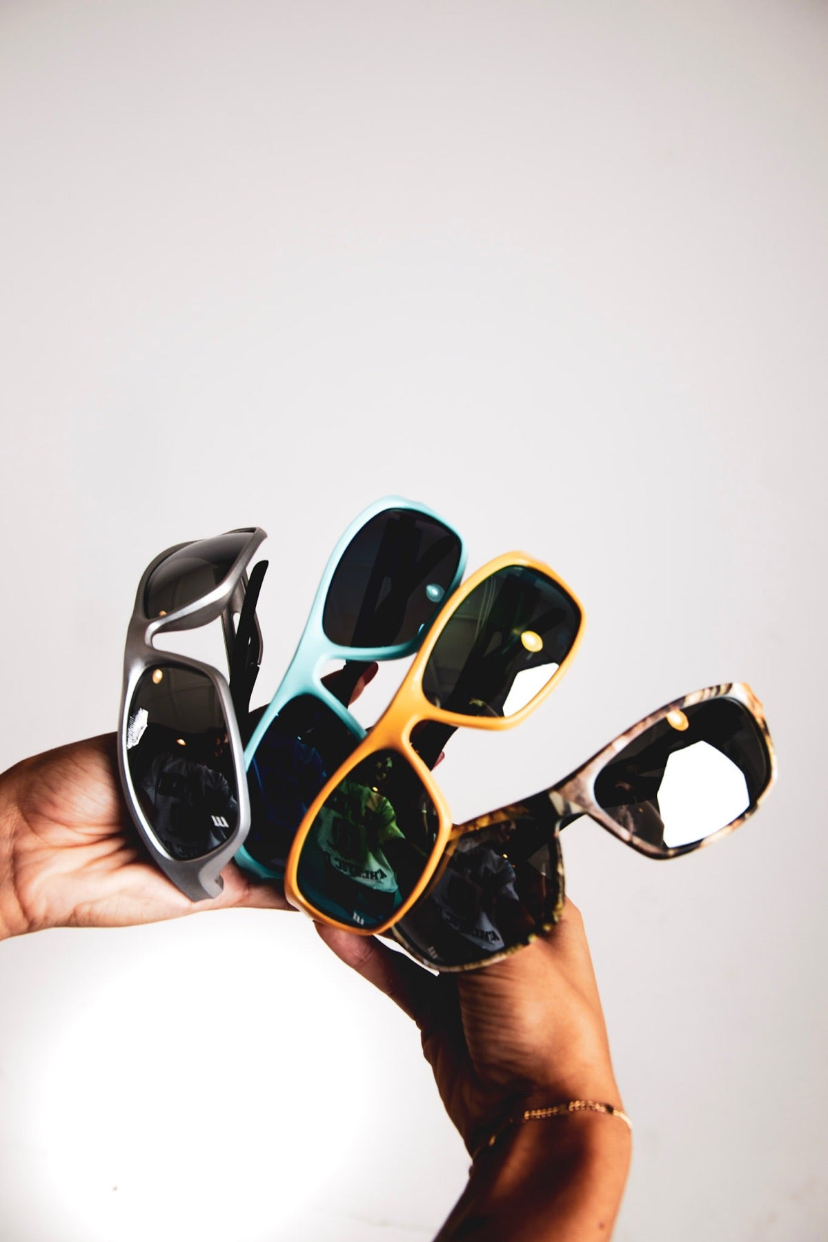 A hand holding four Edge Movement wraps fanned out